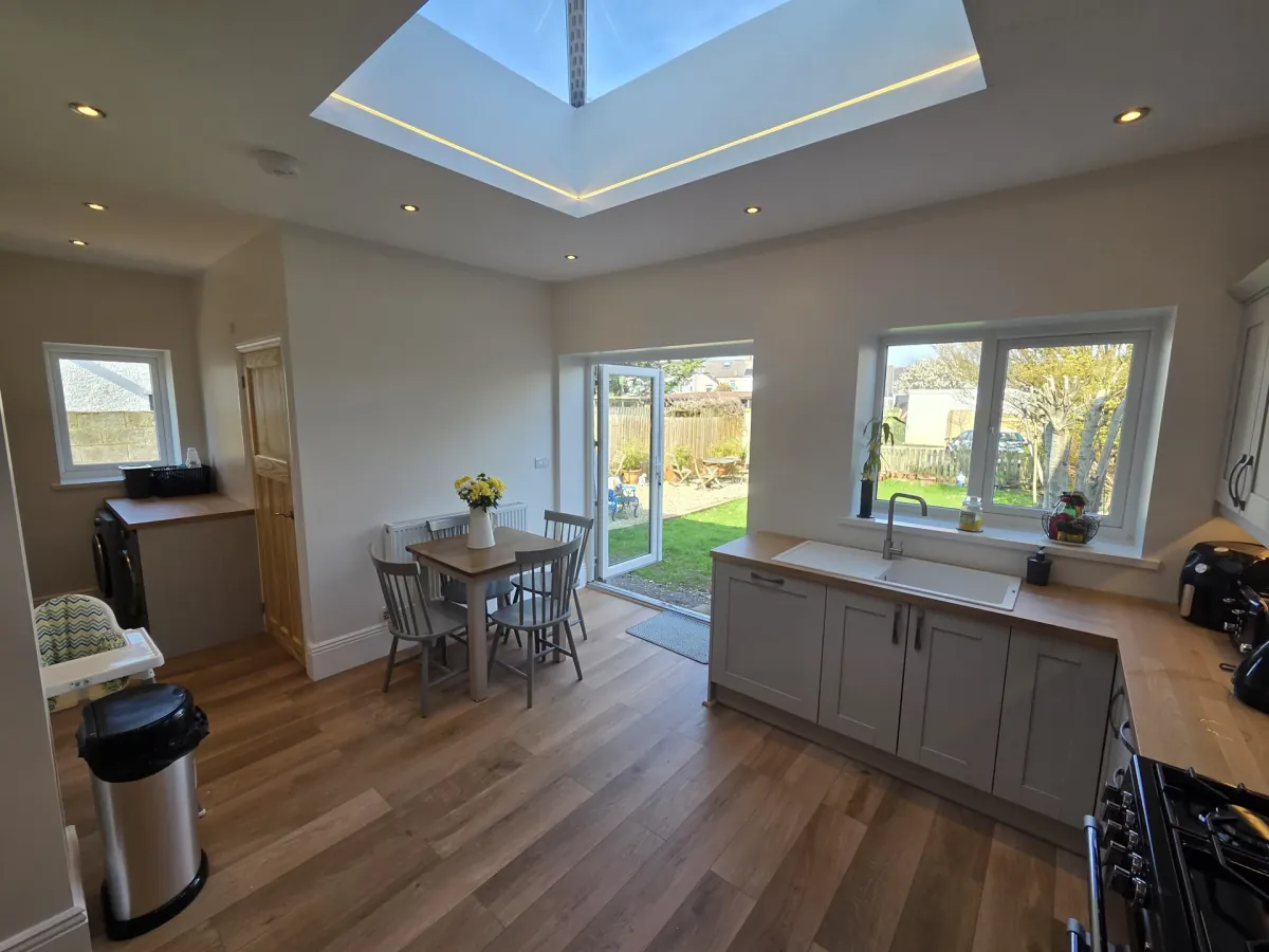 Completed kitchen extension with skylight and oak floor by JRD Construction